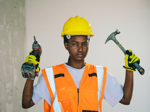 Handywoman Holding Construction Drill 