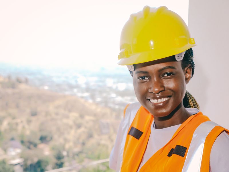 Black female engineer with reflective safety equipment