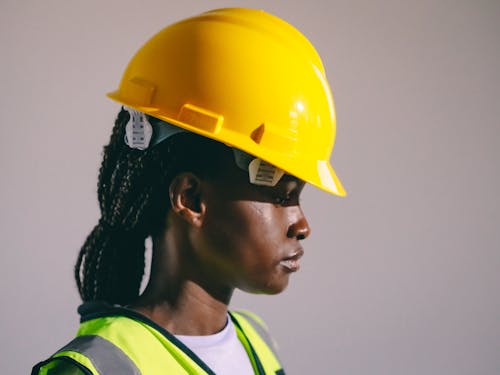 Side View Photo of an Engineer in Yellow Hardhat