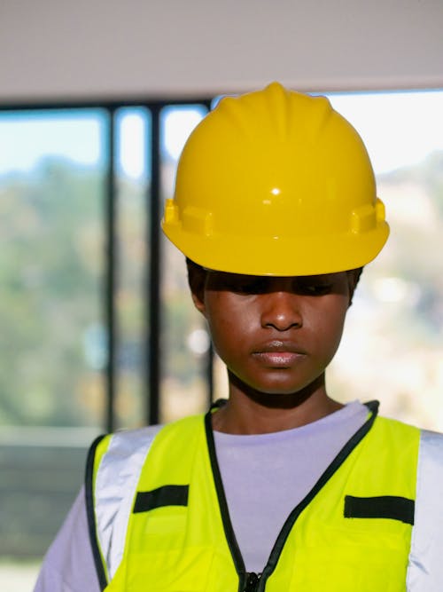 Free Hardhat and Reflective Vest Worn by an Engineer Stock Photo