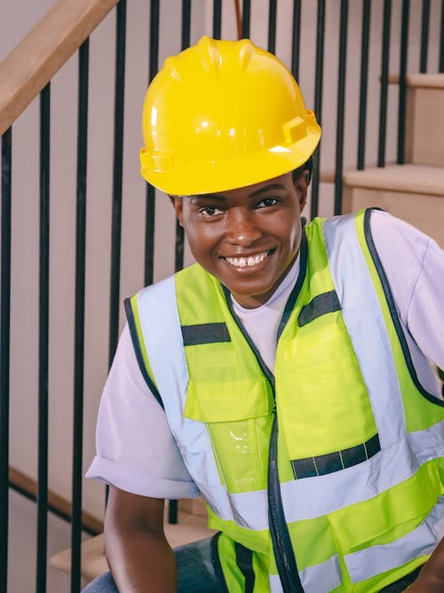 Free Woman Engineer Sitting on Staircase Stock Photo