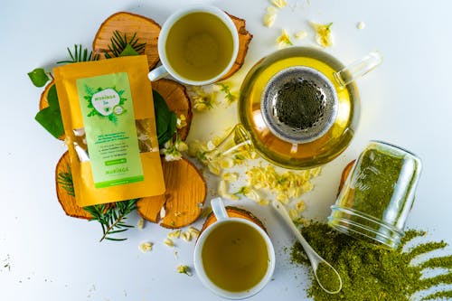 Free Moringa Tea on White Surface Stock Photo