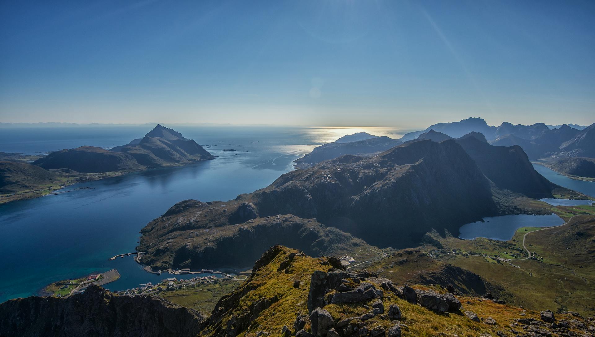 Breathtaking aerial view of the Lofoten Islands in Norway showcasing coastal mountains and serene waters.