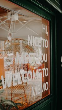 A welcoming shop window display with text saying hi, nice to meet you, welcome to memo.