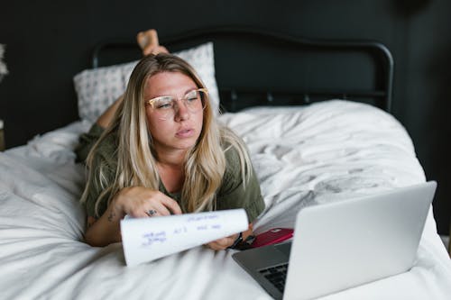 Woman Working on the Bed