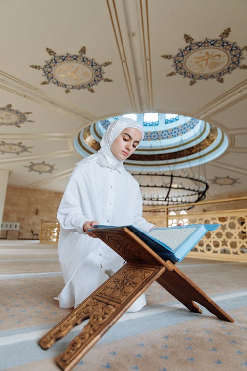 Free Woman Reading the Koran Stock Photo