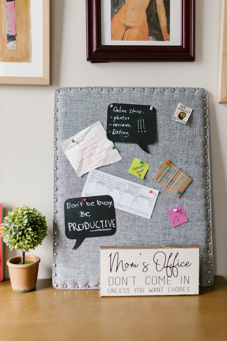 Papers With Message Pinned On The Gray Board 