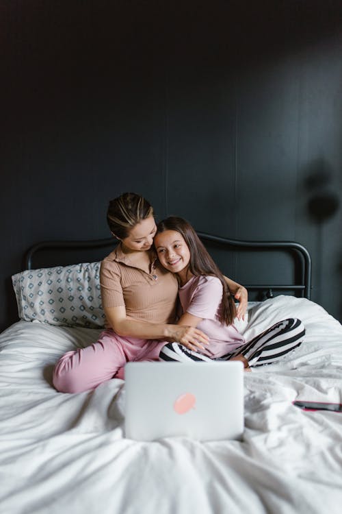 A Mother and Daughter Hugging at Each Other