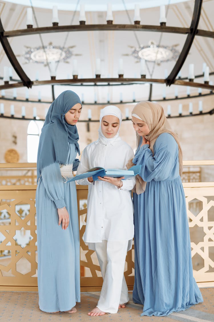 Women Reading Book Inside The Mosque