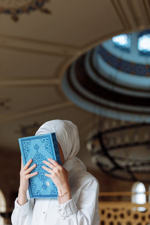 A Woman Holding a Book