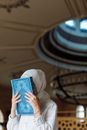 A Woman Holding a Book