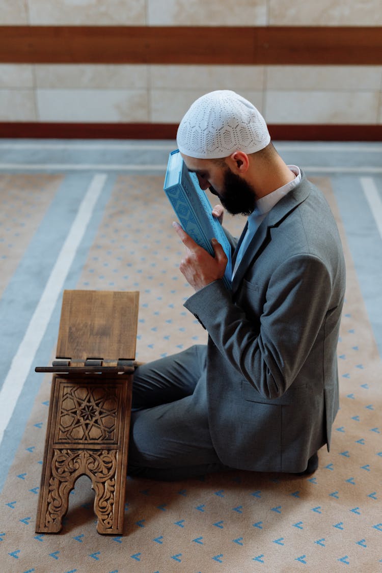 A Man Kneeling In Prayers