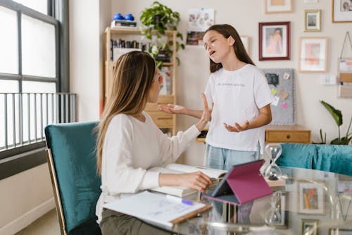 Free Mother and Daughter Having a Conversation Stock Photo