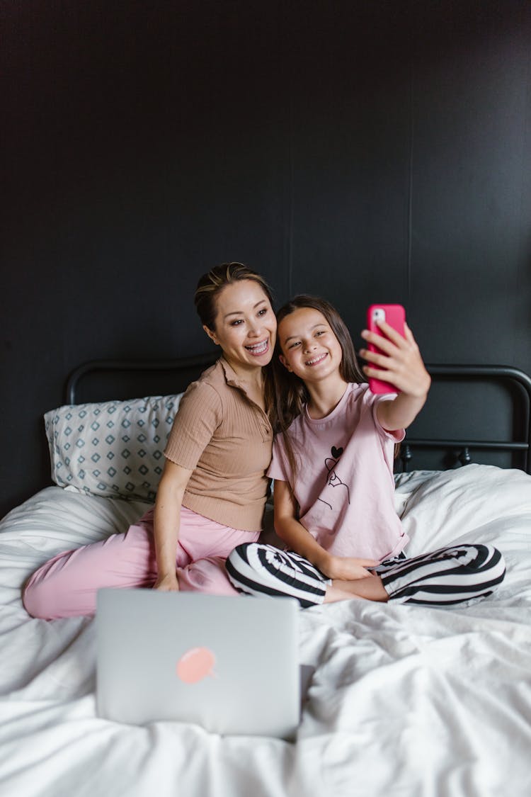 A Mother And Daughter Having A Selfie