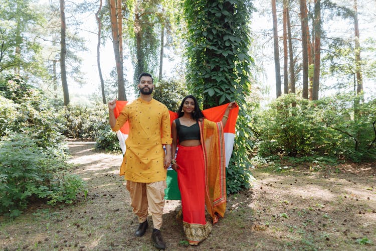 Man And Woman Wearing Traditional Clothes In The Forest