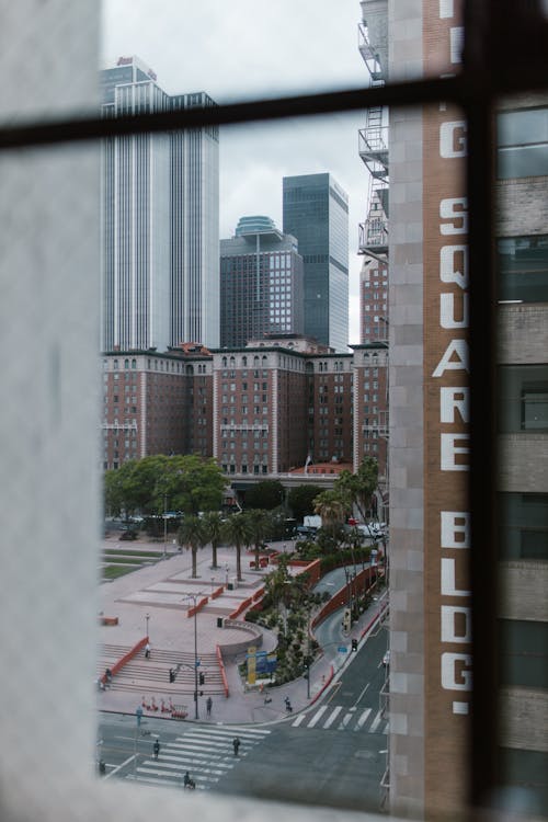 Free Window View on a City Square with Modern Architecture Stock Photo