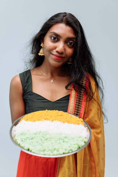 Woman Holding a Tray of Rice