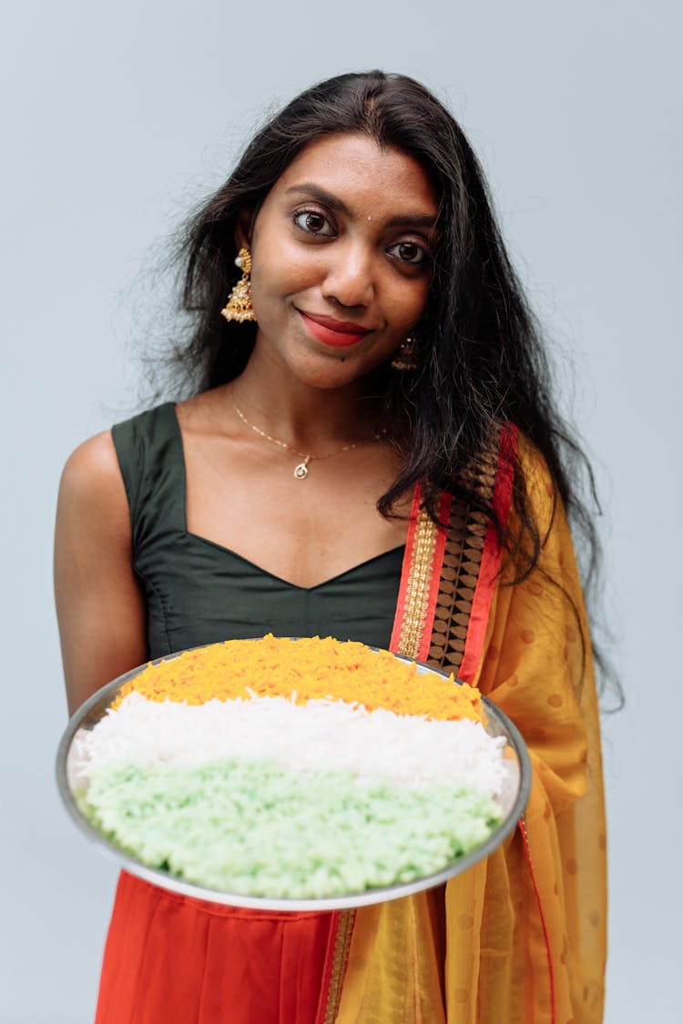 Woman Holding A Tray Of Rice