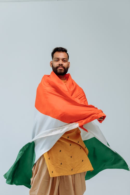 Studio Shoot of a Man Wrapped in an India National Flag