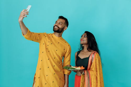 Happy Couple Taking Selfie Using Cellphone