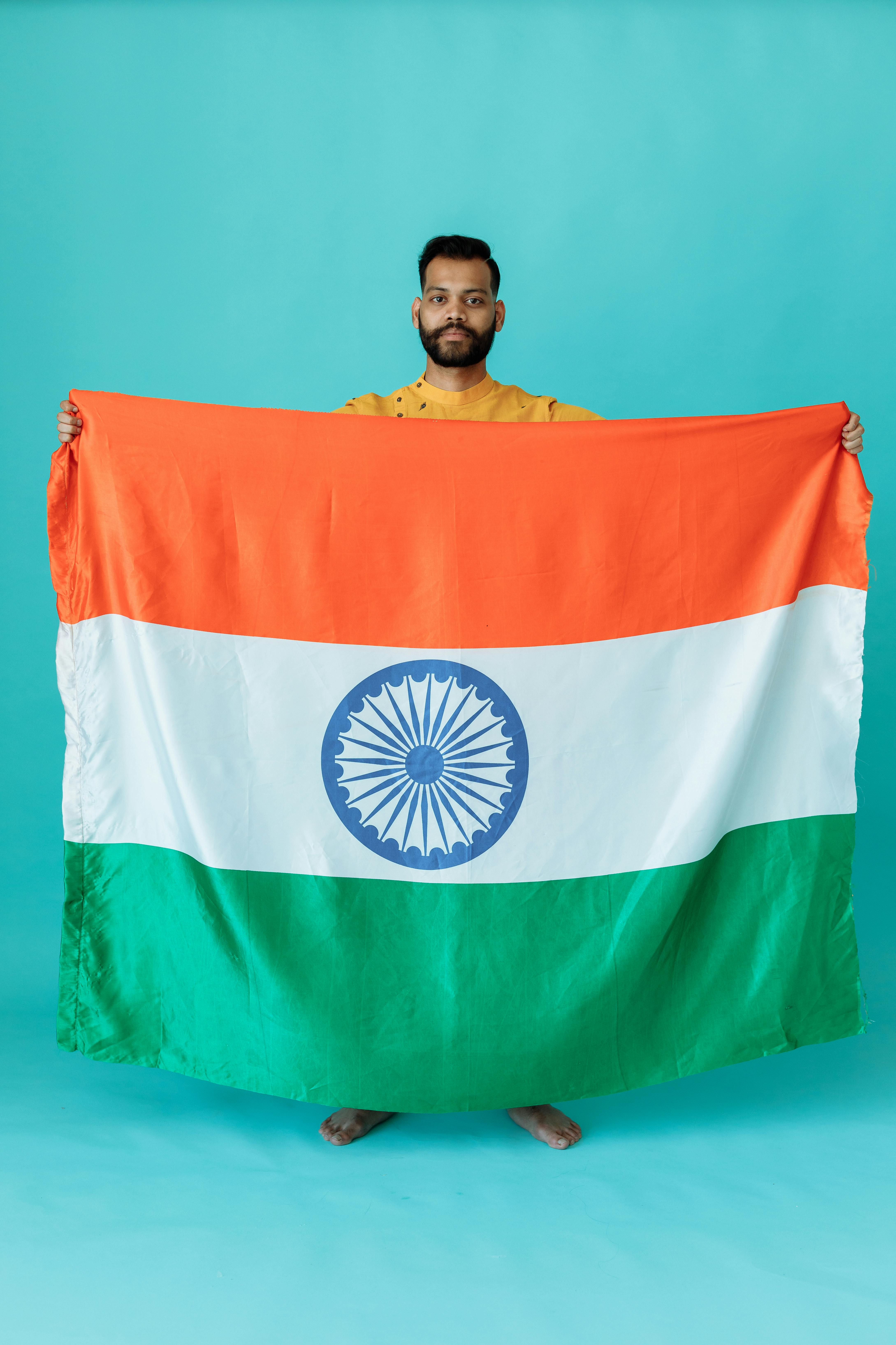 a man holding the flag of india