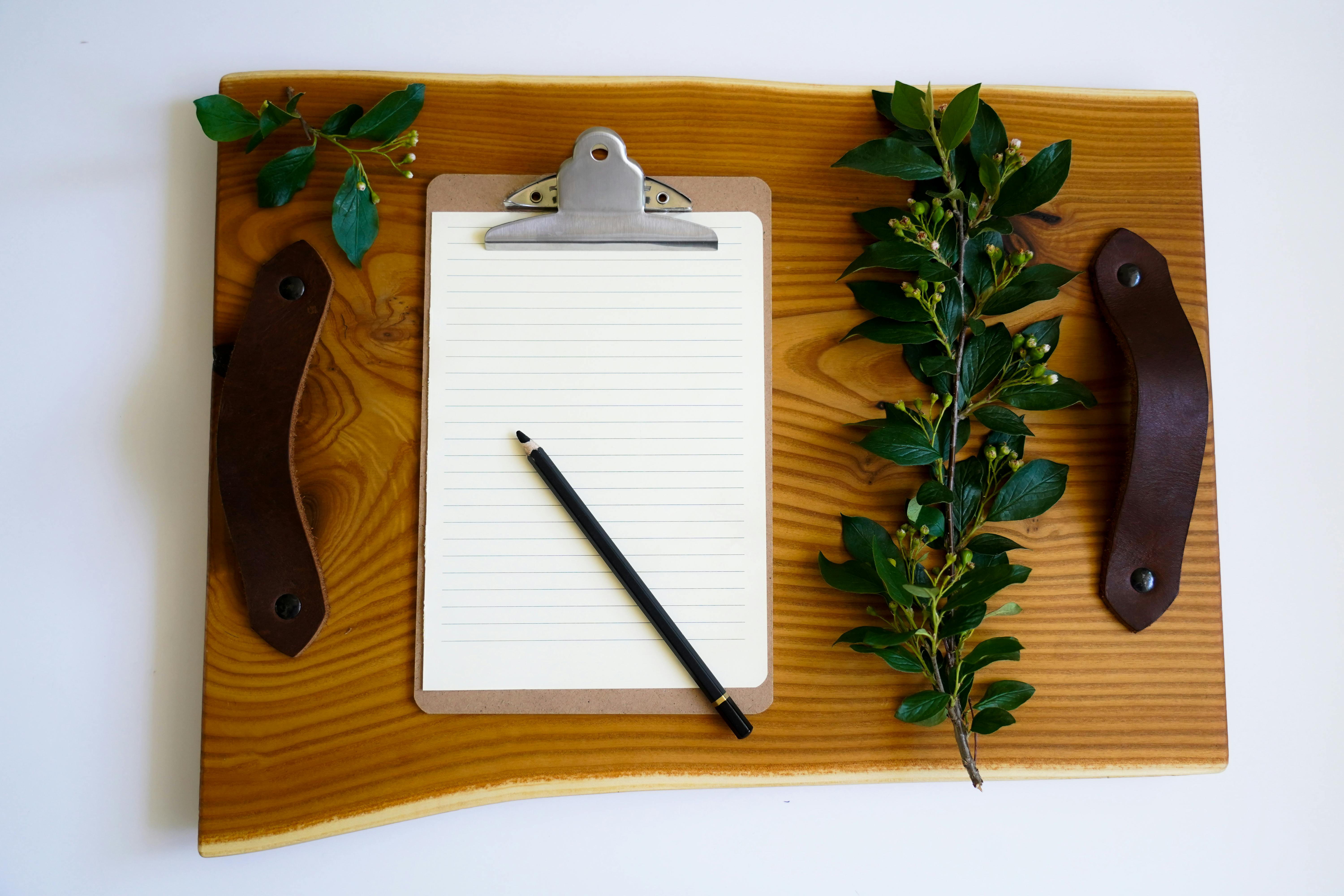 A Paper and Pencil on the Table · Free Stock Photo