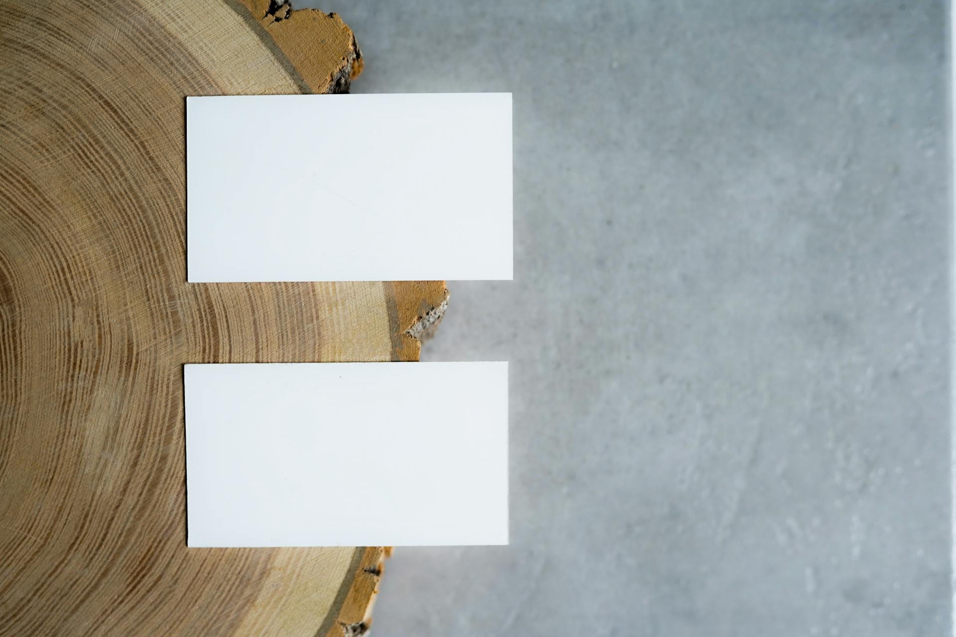 White Papers on the Edge of a  Wooden Table