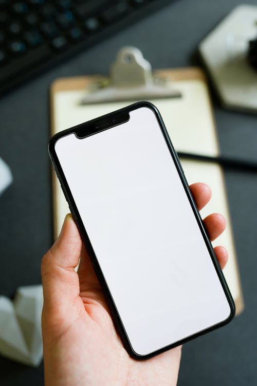 Close-Up Shot of a Person Holding a Cellphone