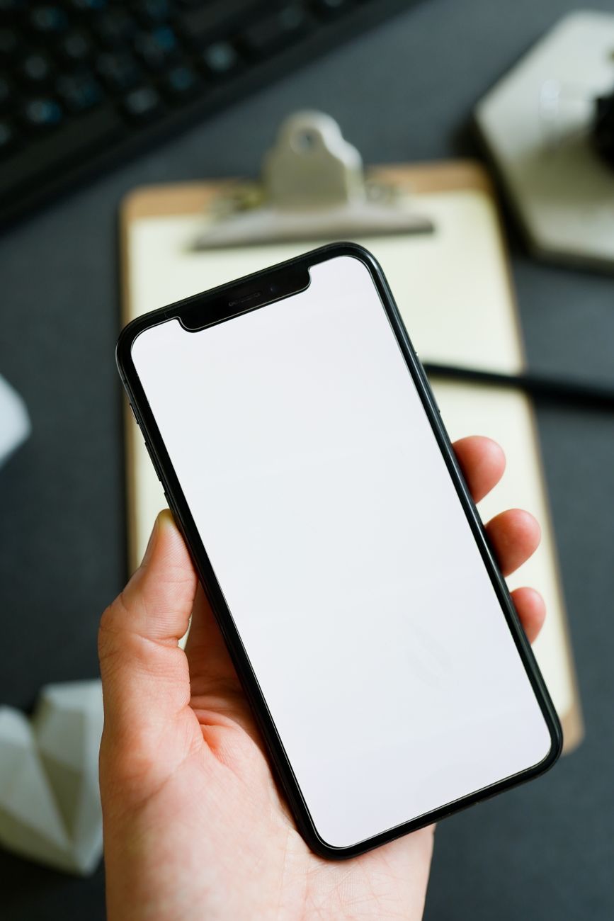 Hand holding smartphone with an app ready for Google Play release