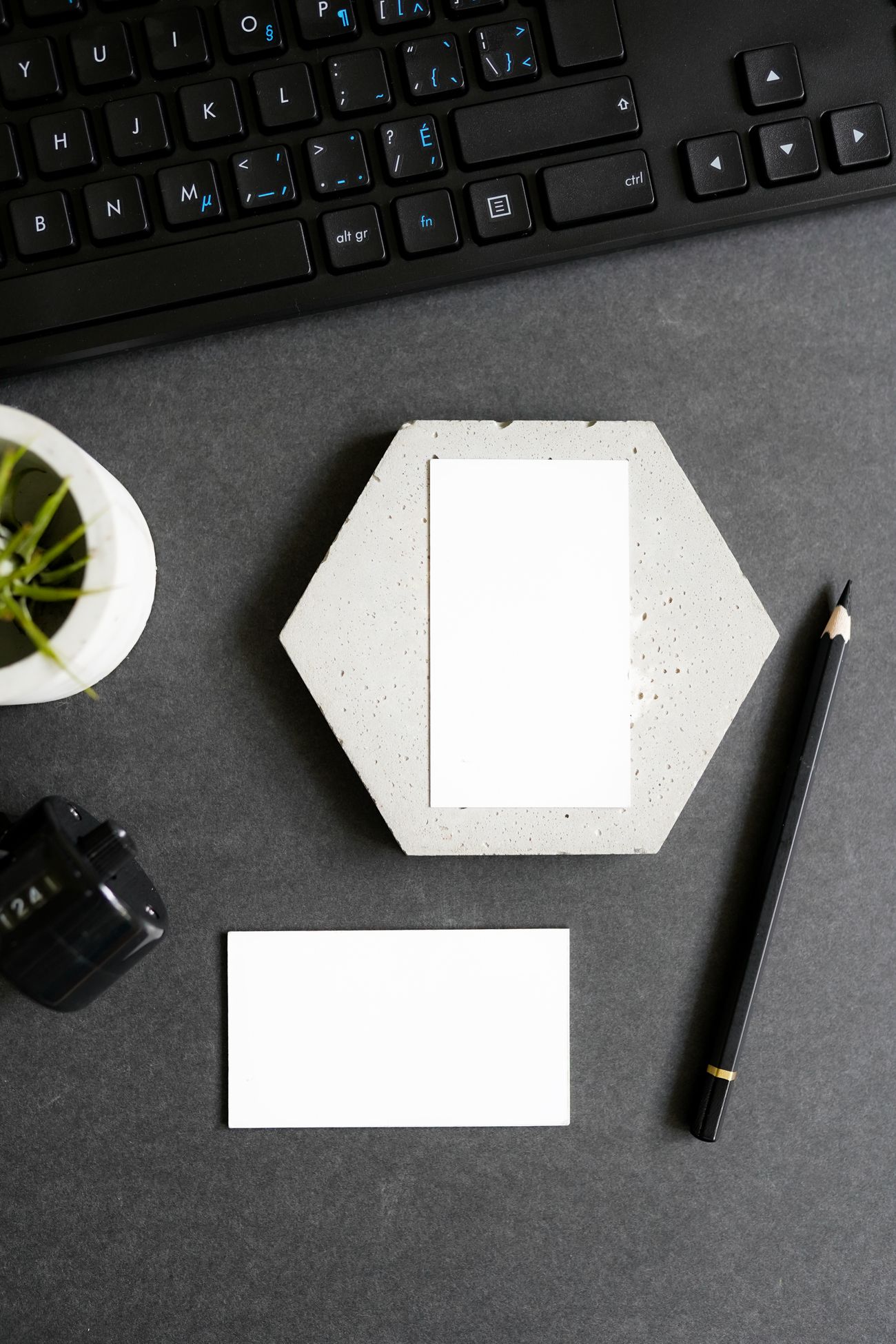 Business cards and branded stationery on a designer's desk