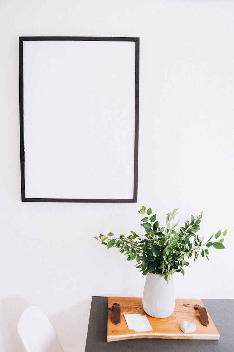 Blank Frame Hanging On The Wall