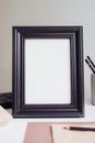 Black Wooden Frame on Brown Wooden Table