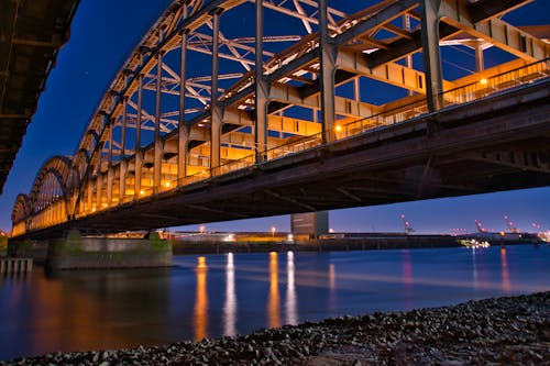 A Steel Bridge over the River at Night