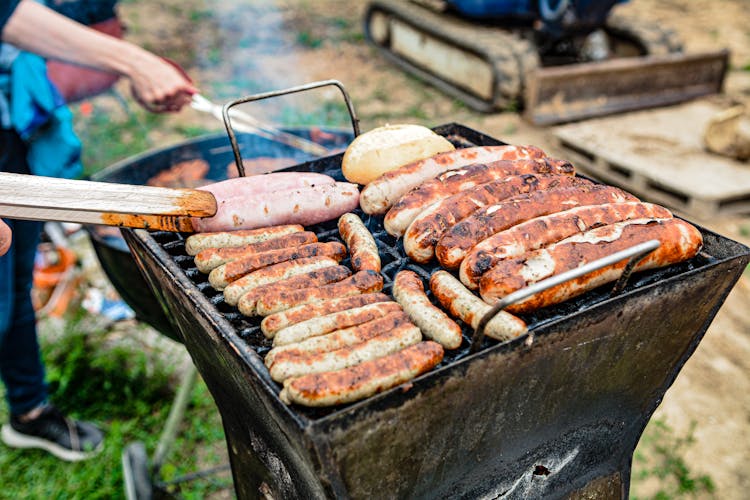 Sausages On Black Grill