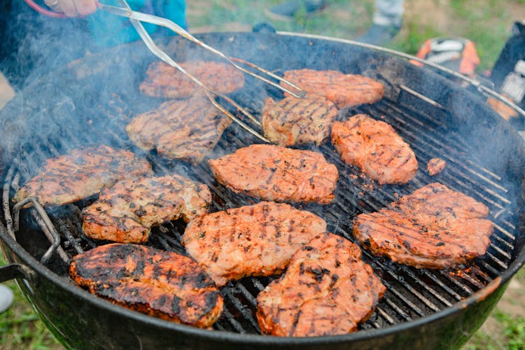 Grilled Meats On Black Charcoal Grill