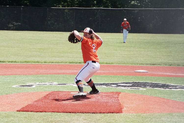 Pitcher Throwing Ball During Baseball Game