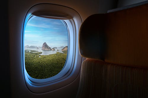 Free Flying Airplane Window  View
 Stock Photo
