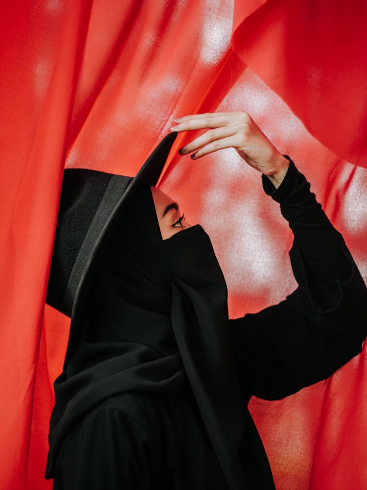 Woman In Black Abaya Wearing Black Hat 