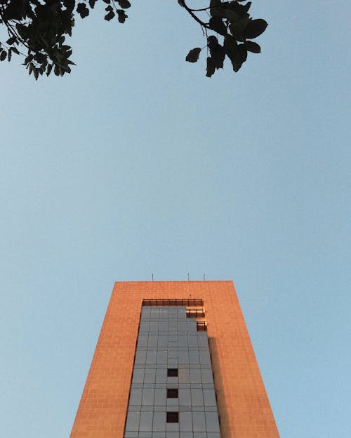 Free stock photo of block building, orange, sky Stock Photo