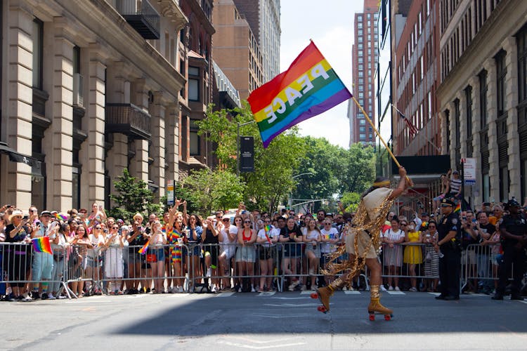 People With LGBT Flag On Pride Parade