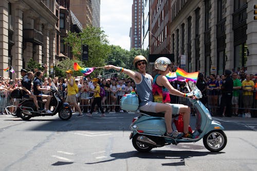 Two People Riding on Motorcycle on Road