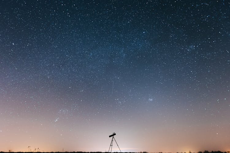 Silhouette Of Binocular Under Starry Sky