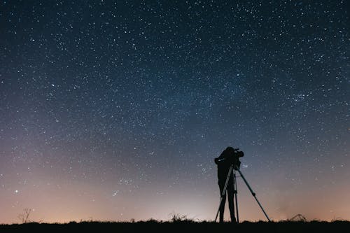 Free Silhouette of Person Under Starry Sky Stock Photo