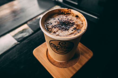 Free Coffee in Brown Paper Cup Stock Photo