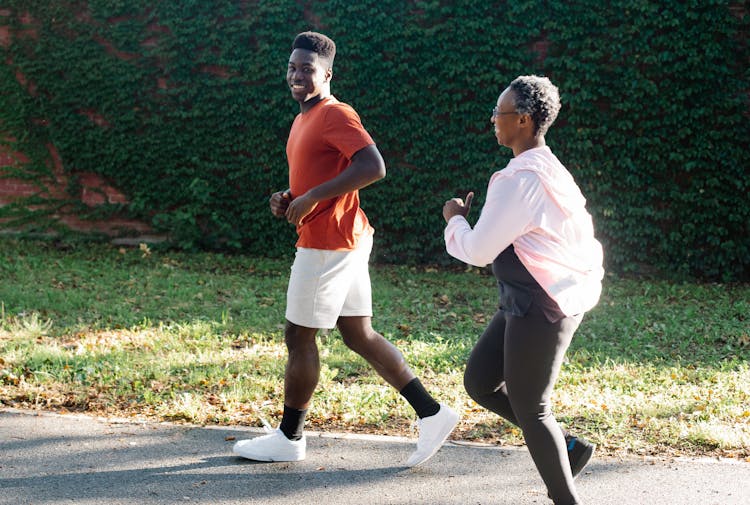 Man And Woman Jogging Outdoors