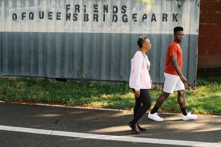 A Man And Woman Walking Together 