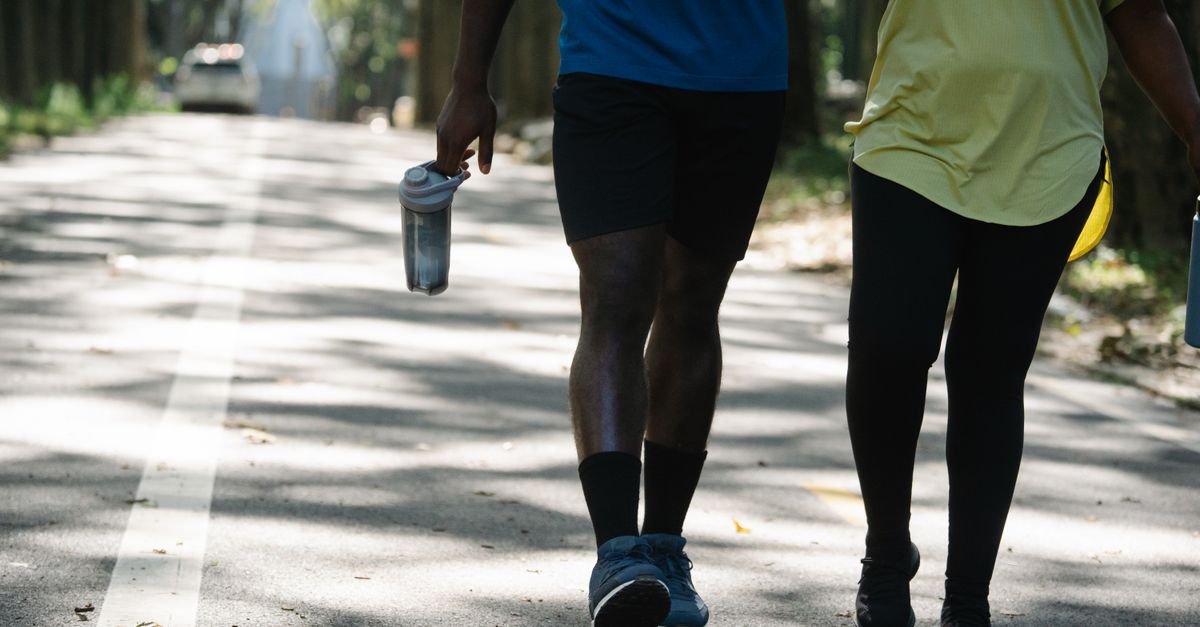 Two people enjoying a relaxed walk outdoors