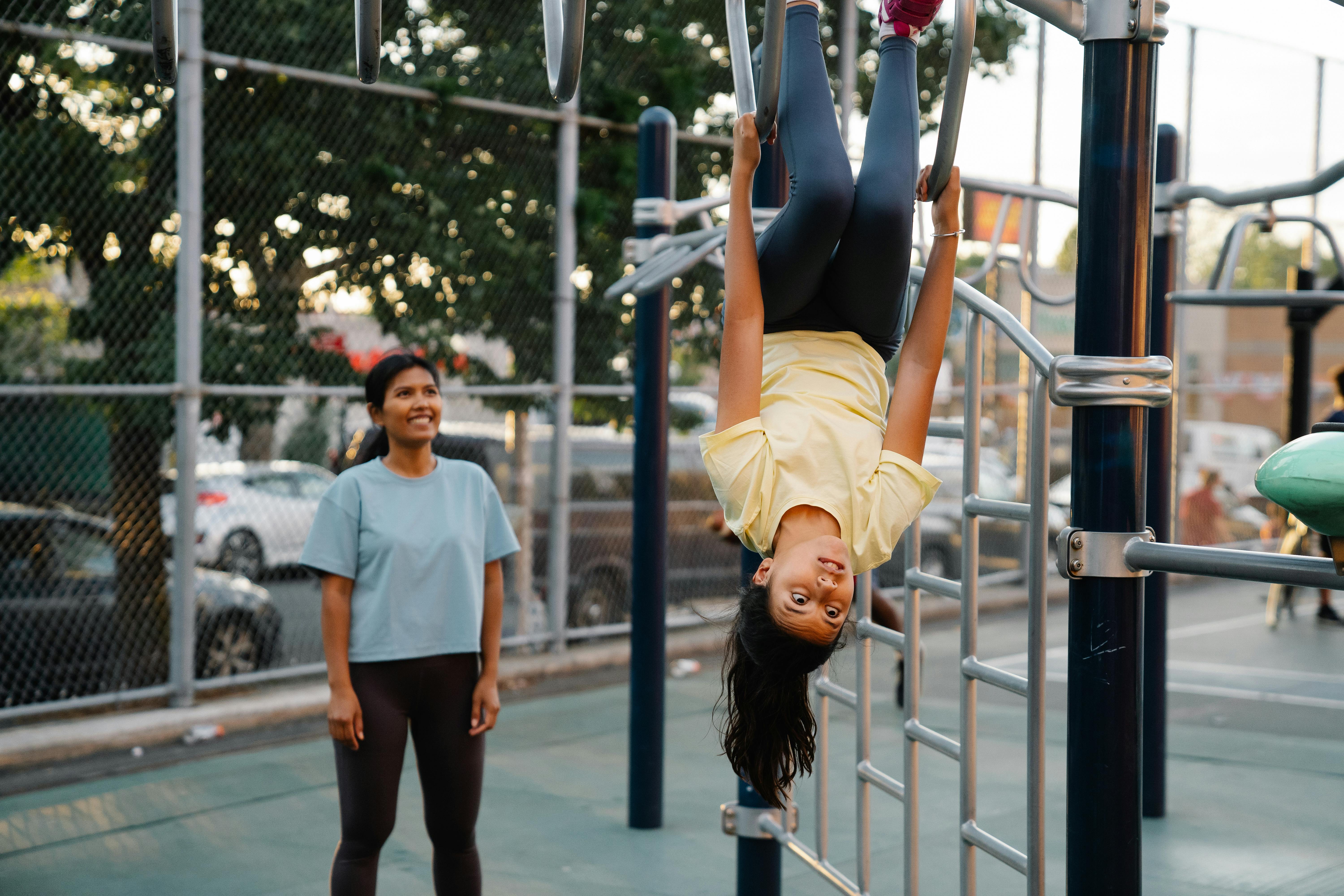 girls practicing acrobatics on playground