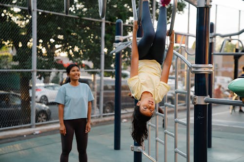 Girls Practicing Acrobatics on Playground