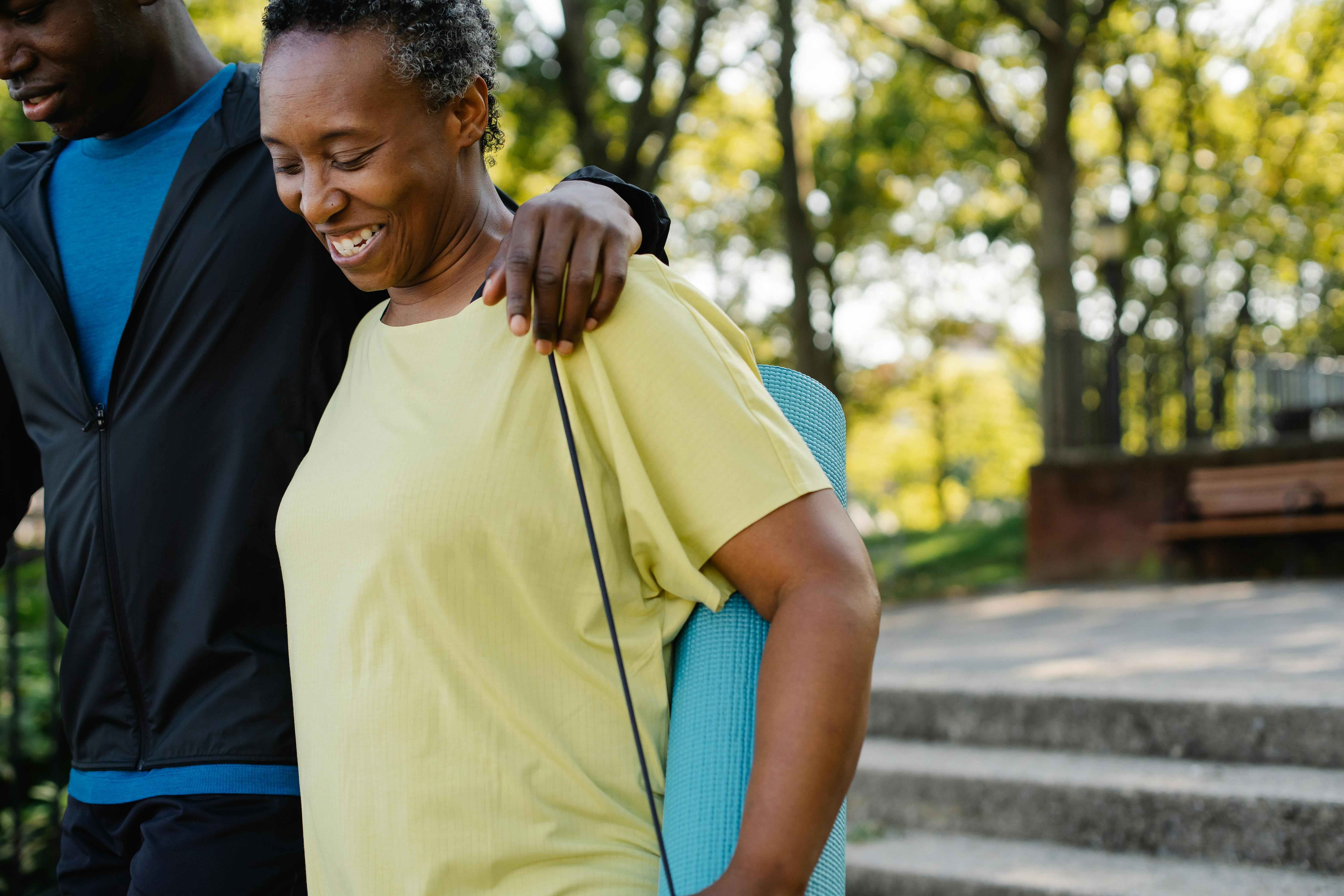 Smiling Young Couple Training Outside Together · Free Stock Photo